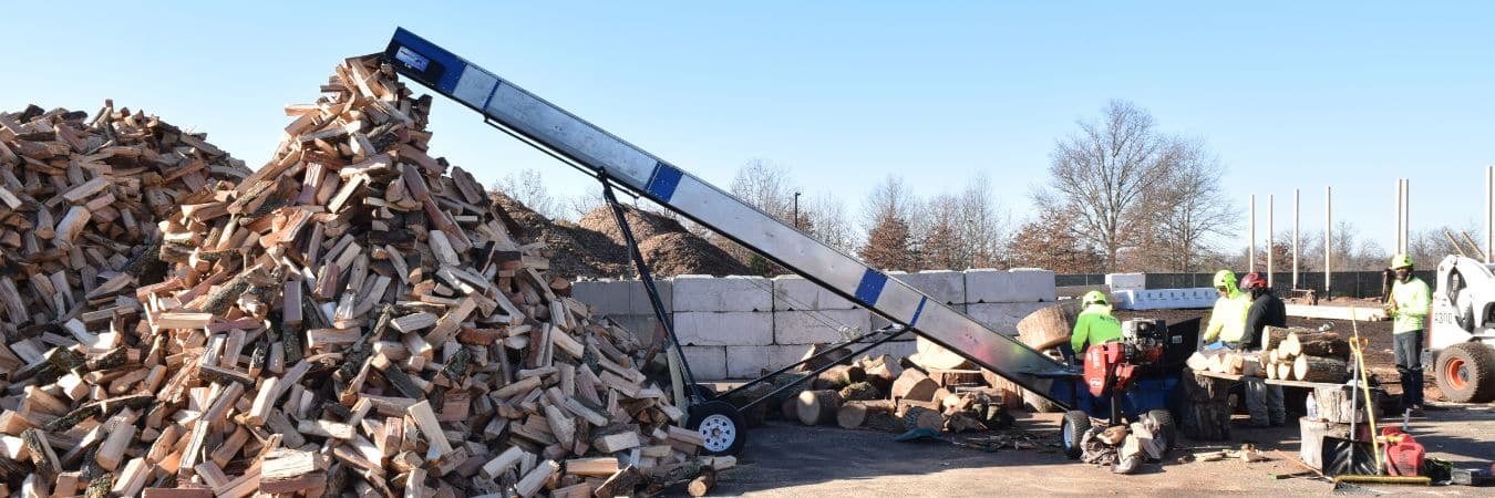 The Clauser team processing lumber into firewood after a tree removal.