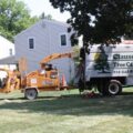 The Clauser Tree Care truck working in a yard in the summer in Chalfont, PA.